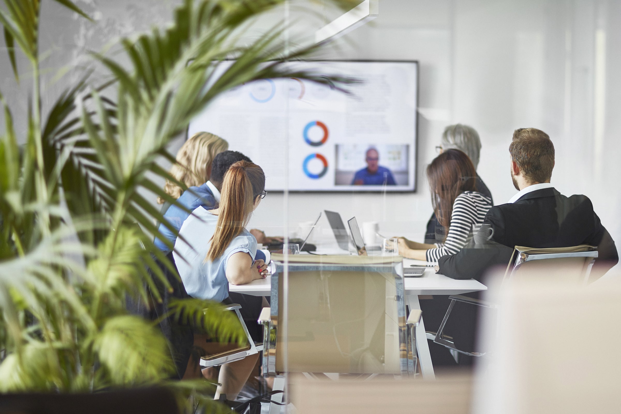 Image of group of people in conference room on a video call